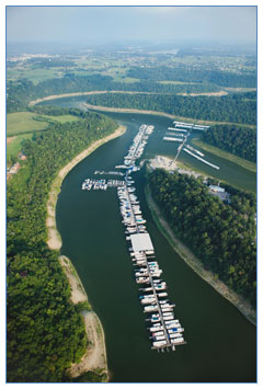 Aerial view of a marina with plenty of boats parked at its docks