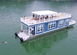 Blue houseboat with a spacious rooftop deck